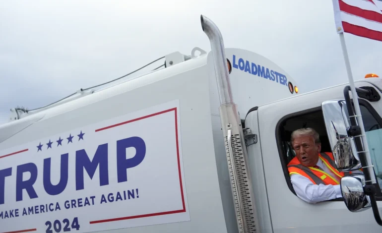 Trump Rides “Garbage Truck” in Apparent Dig at Biden’s “Garbage” Remark