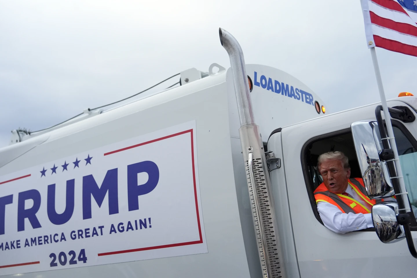 Trump Rides “Garbage Truck” in Apparent Dig at Biden’s “Garbage” Remark