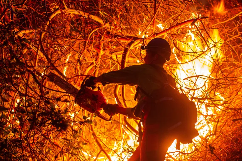 Los Angeles Wildfires Claim 24 Lives, Threaten Renewed Fury as Winds Return