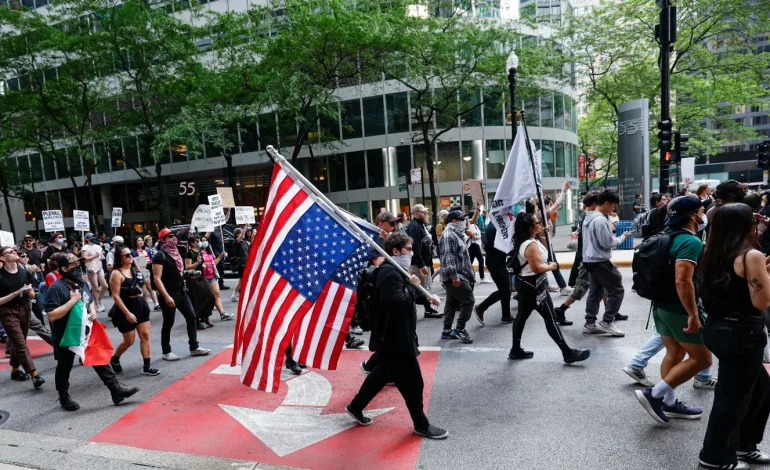 Car Drives Through Anti-ICE Protesters in Downtown Chicago Amid National Unrest