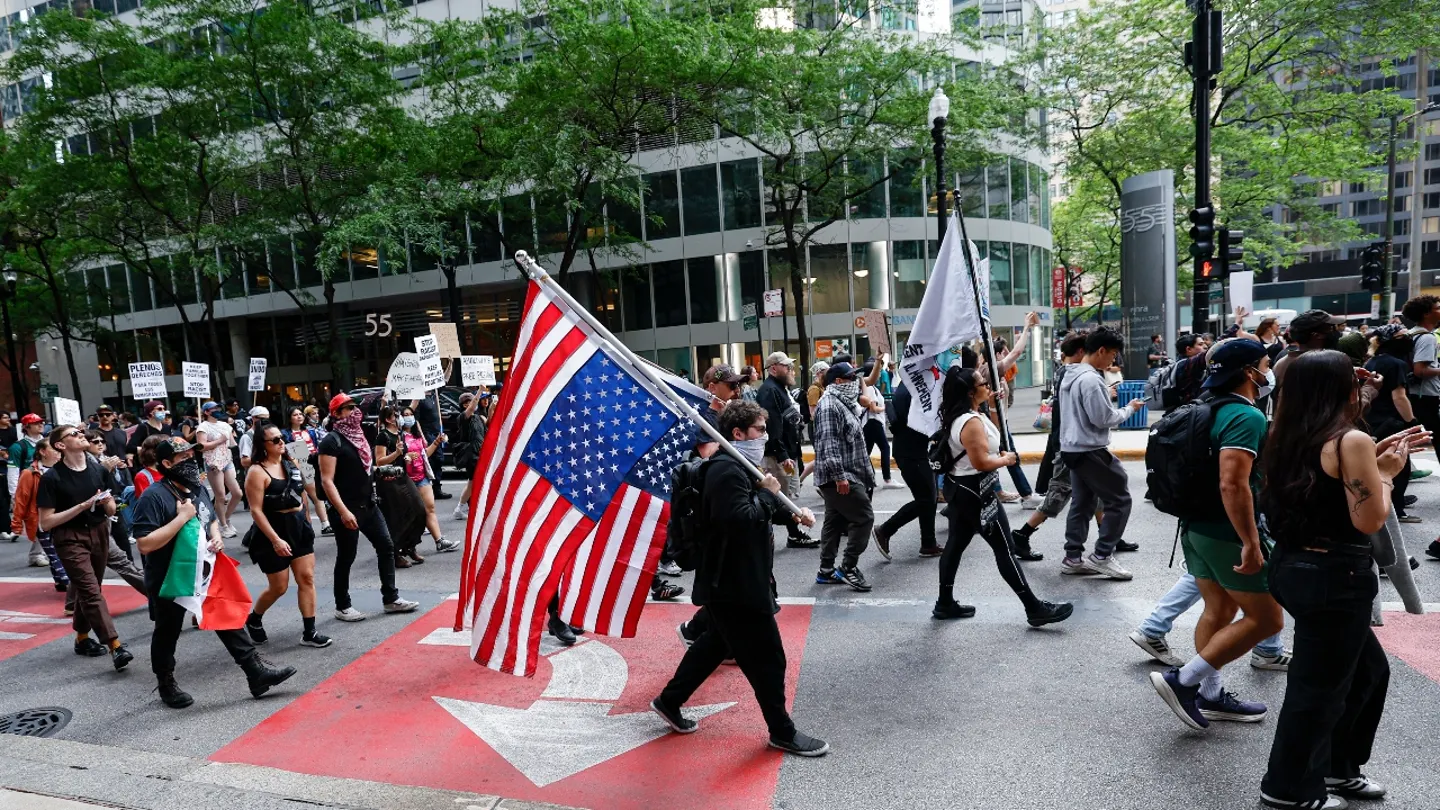 Car Drives Through Anti-ICE Protesters in Downtown Chicago Amid National Unrest