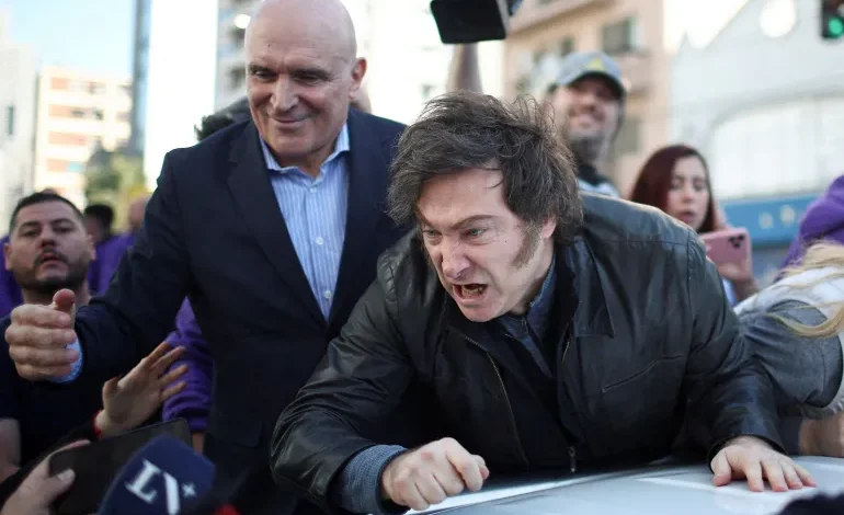 Argentina’s Milei rushed from rally after protesters throw rocks