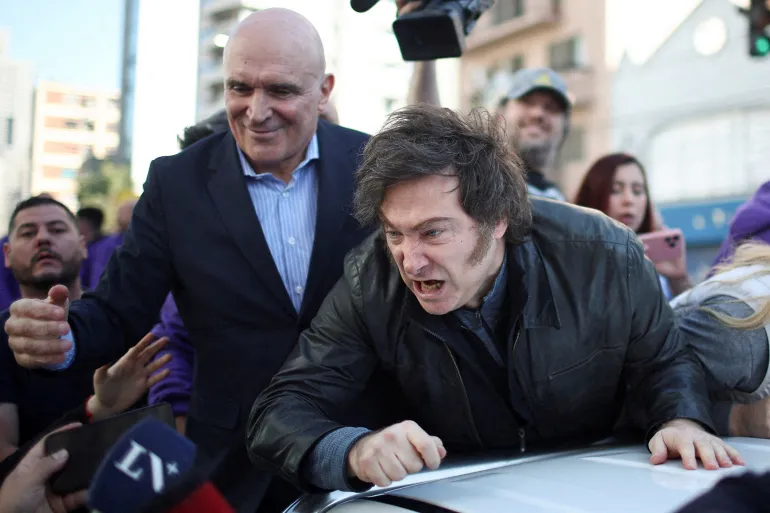 Argentina’s Milei rushed from rally after protesters throw rocks