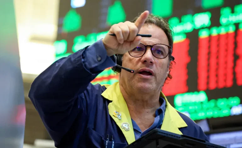 Wall Street wobbles at record highs as shutdown drags into Day 2