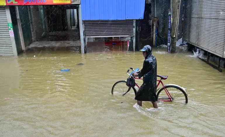 Sri Lanka shuts schools and offices as floods kill 56 and devastate communities