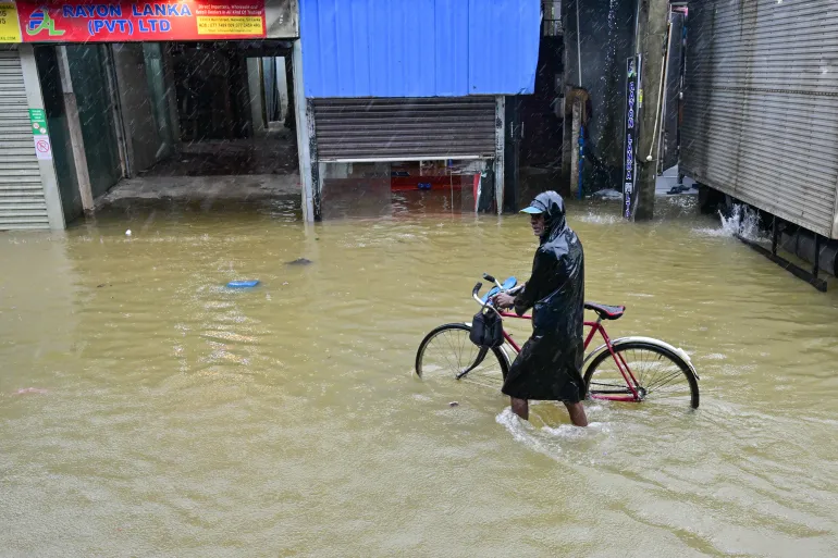 Sri Lanka shuts schools and offices as floods kill 56 and devastate communities