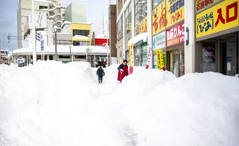 Japan’s snow emergency turns deadly as record drifts bury towns