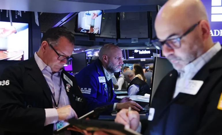 Markets wobble, then steady — oil chills below $100 and the Dow trims a 900-point drop to about 400