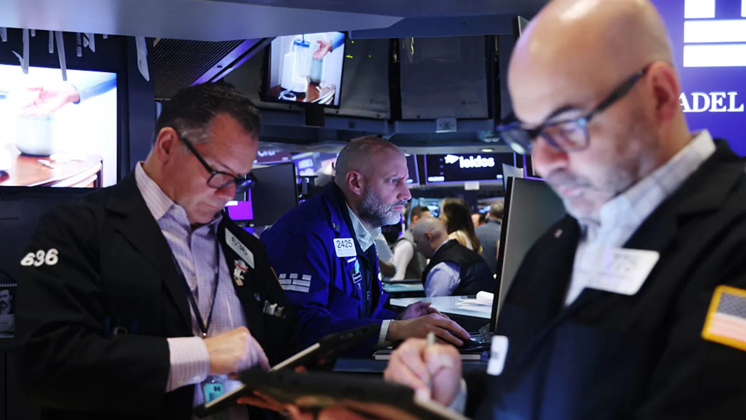 Markets wobble, then steady — oil chills below $100 and the Dow trims a 900-point drop to about 400