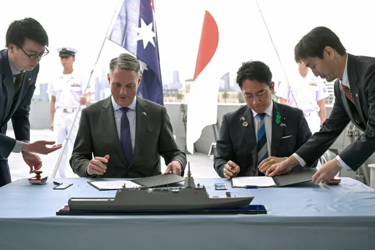 Australia, Japan seal $7bn warship deal as defence ties deepen