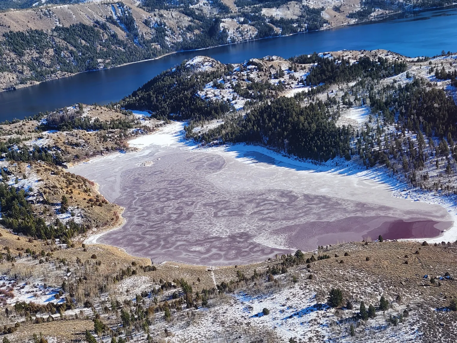 Wyoming lake’s unnerving rusty-red water persists as experts offer explanations
