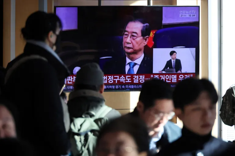 South Korea court cuts ex-PM Han Duck-soo’s sentence in martial law case